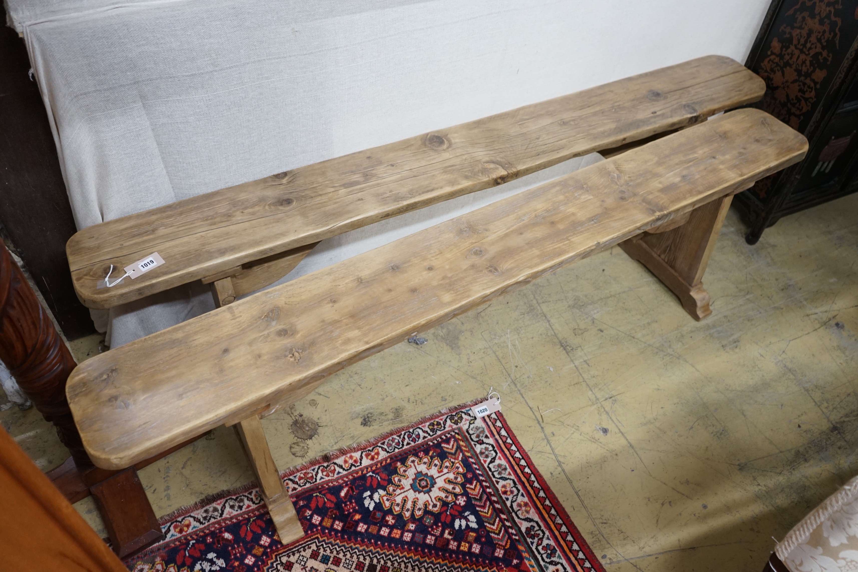 A pair of 19th century provincial pine benches, length 179cm, depth 22cm, height 47cm